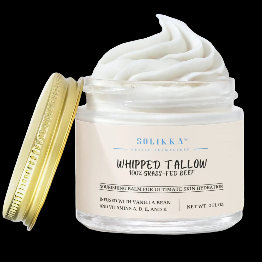 Creamy whipped grass-fed tallow balm with vanilla bean scent by Solikka, showing the smooth, pale balm texture in a jar.