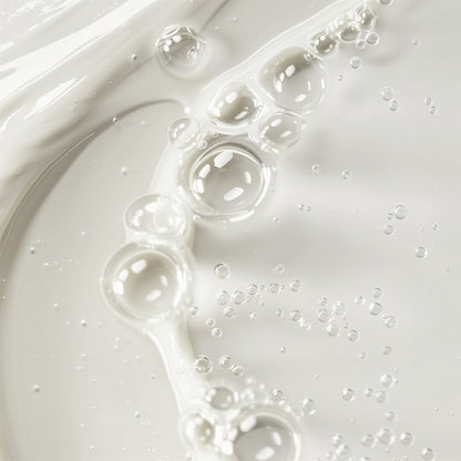 Close-up of toner with bubbles on a light gray background