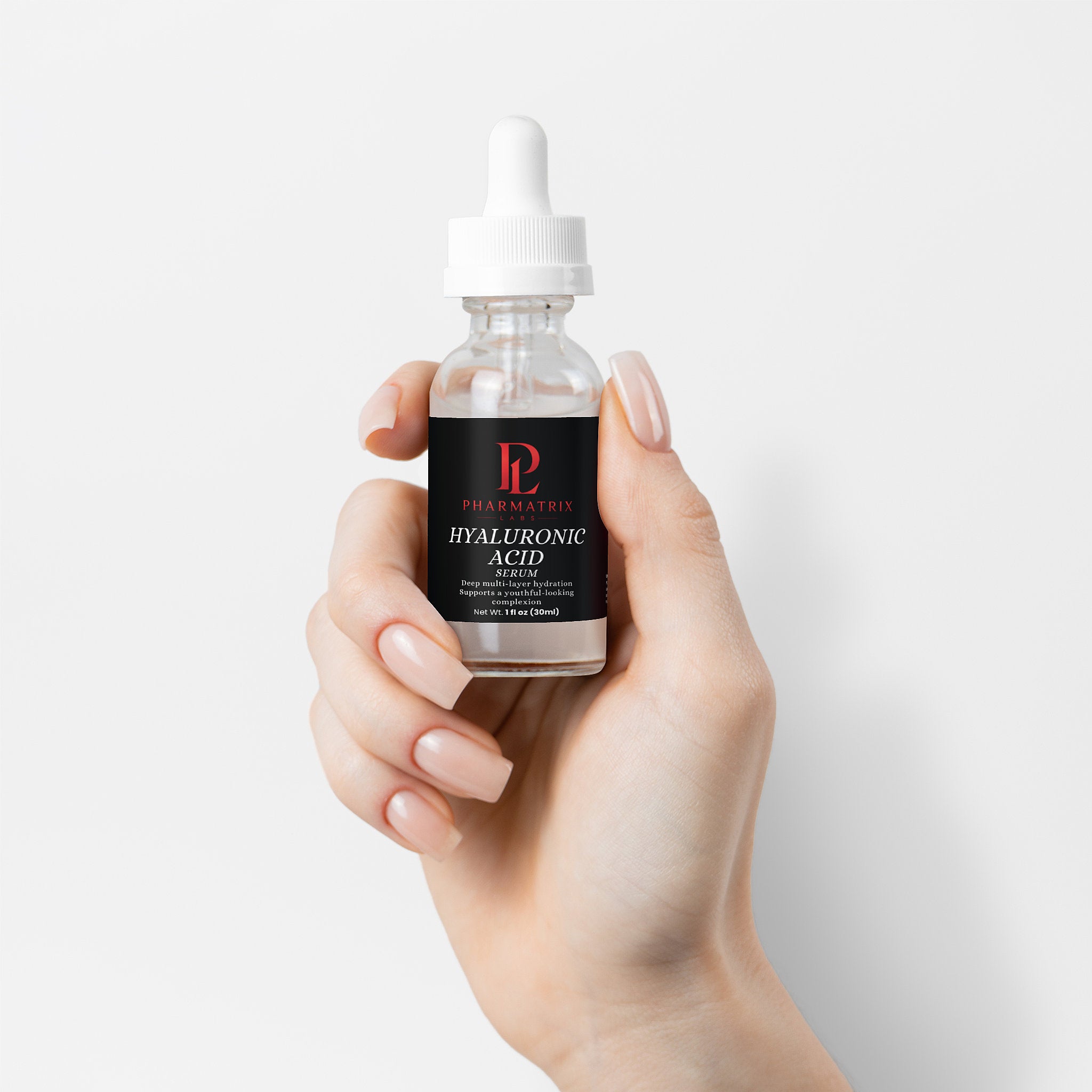 Hand holding a bottle of nova Hyaluronic Acid Serum against a light gray background