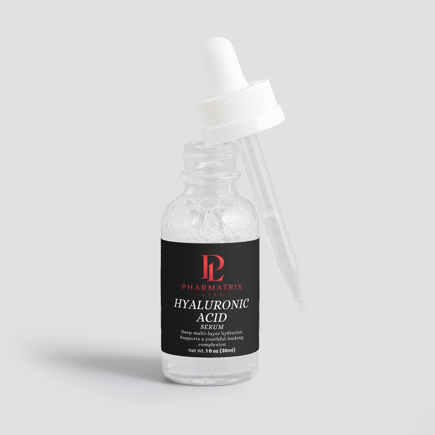 Bottle of Pharmatrix Hyaluronic Acid Serum on a light gray background with dropper