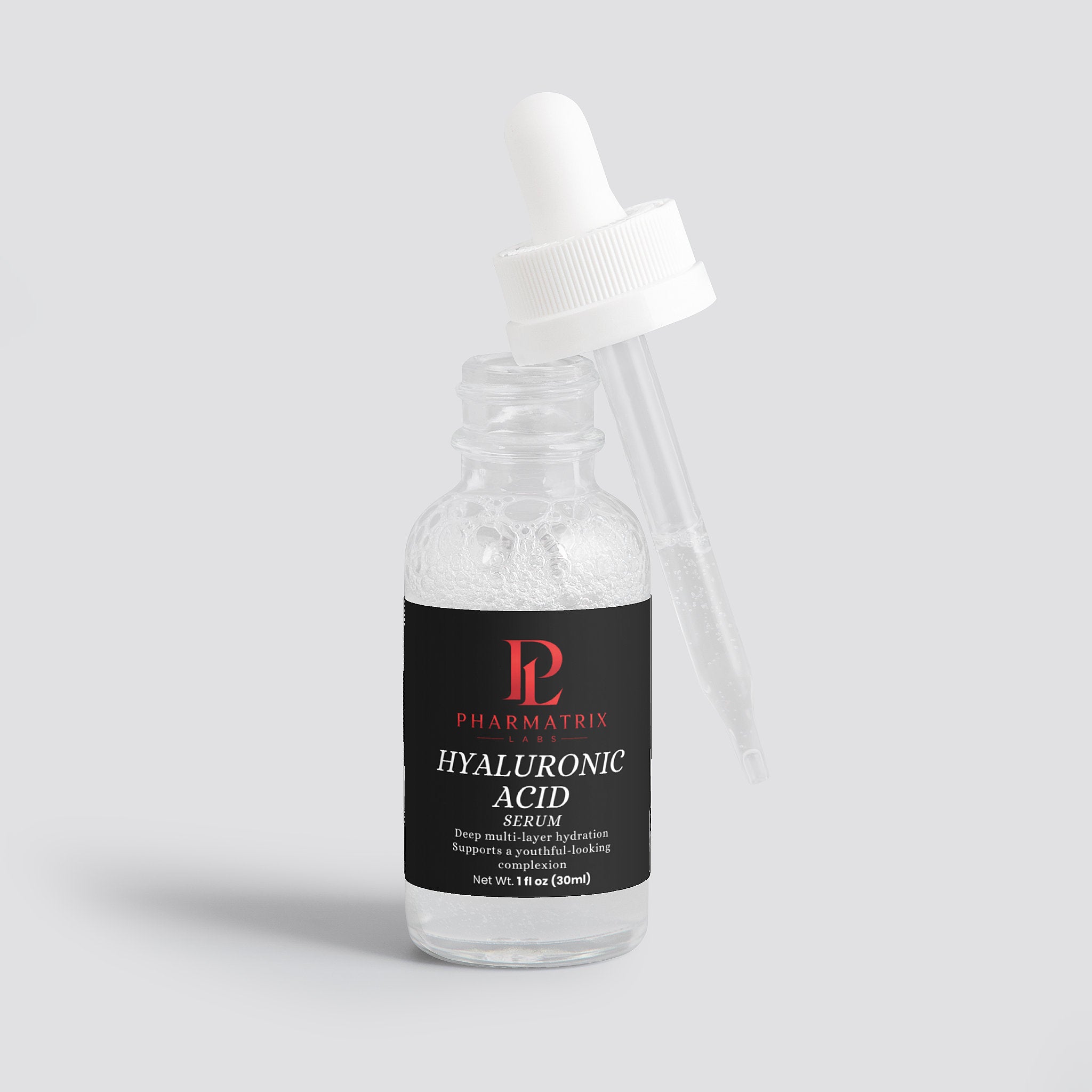 Bottle of Pharmatrix Hyaluronic Acid Serum on a light gray background with dropper